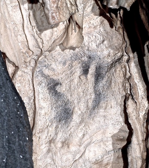 Prehistoric negative hand imprint from Cueva de Ardales. Photo from Information Centre